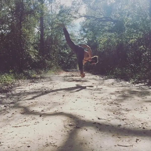 Handstand on a forest trail